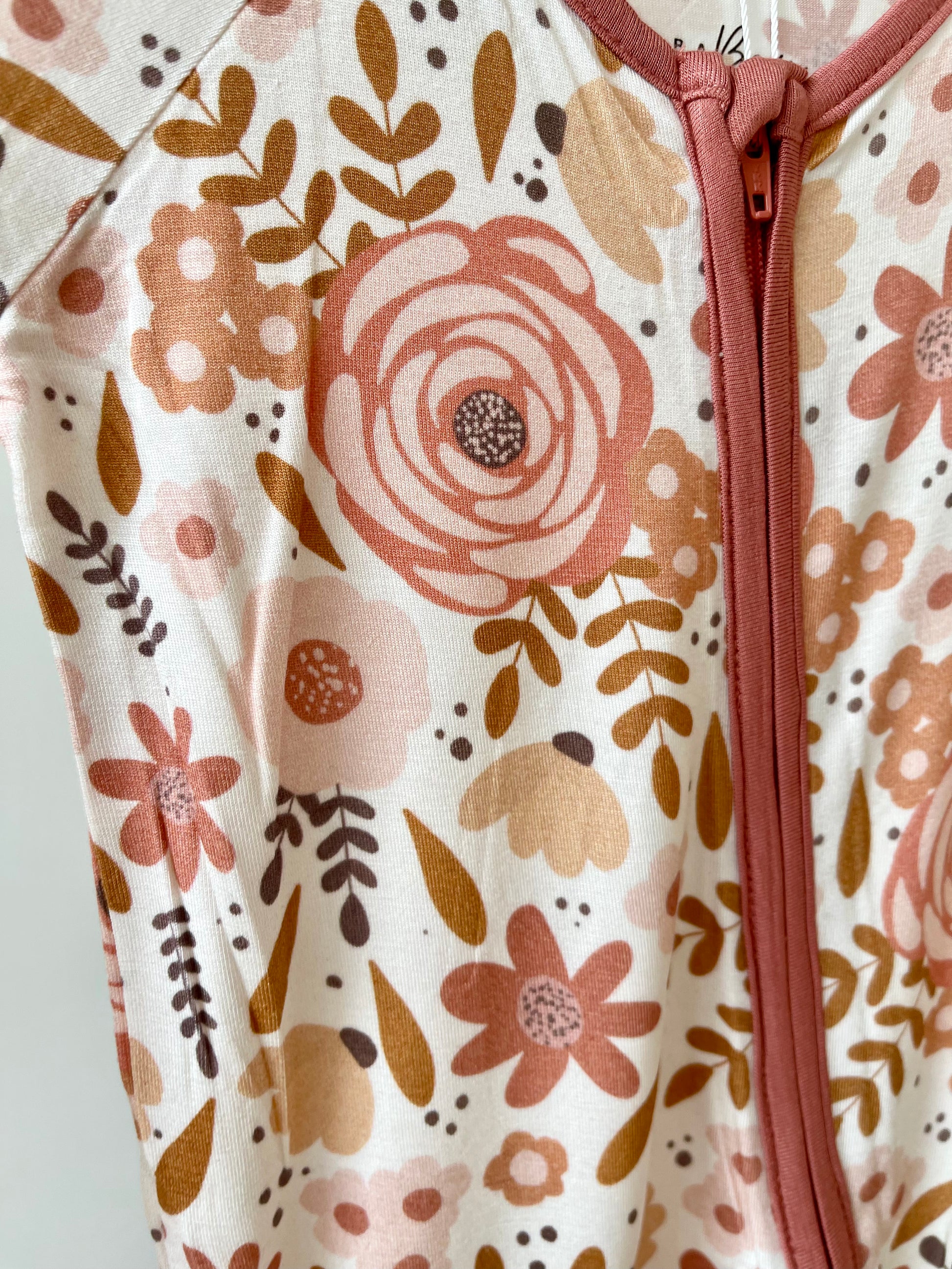 mauve floral bamboo onesie up close details